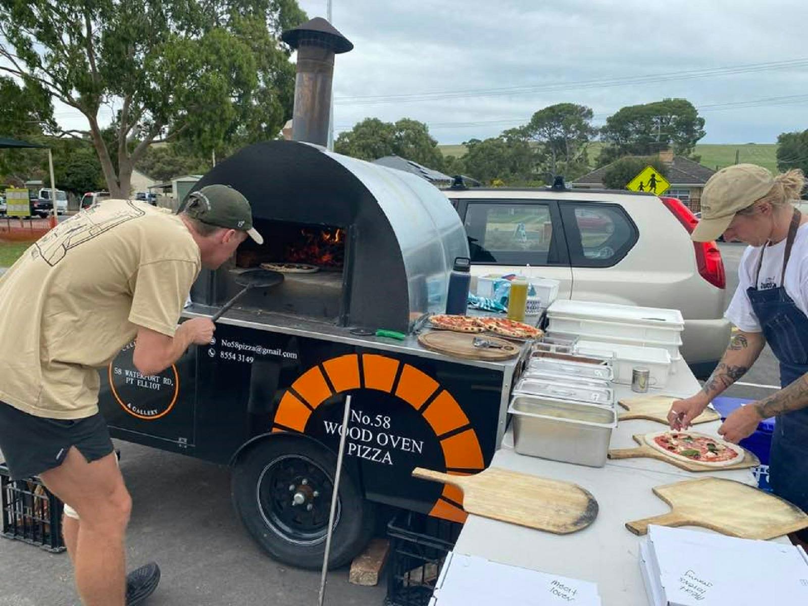 Preparing pizzas for the community event