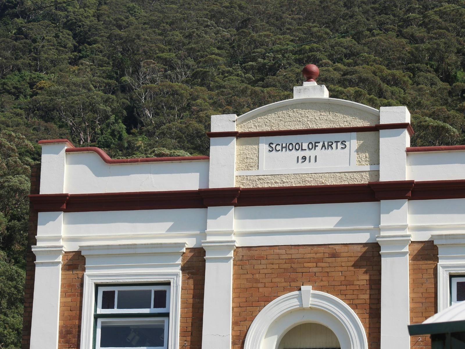 Front view of Clifton School of Arts, with the western hills of the Illawarra escarpment behind