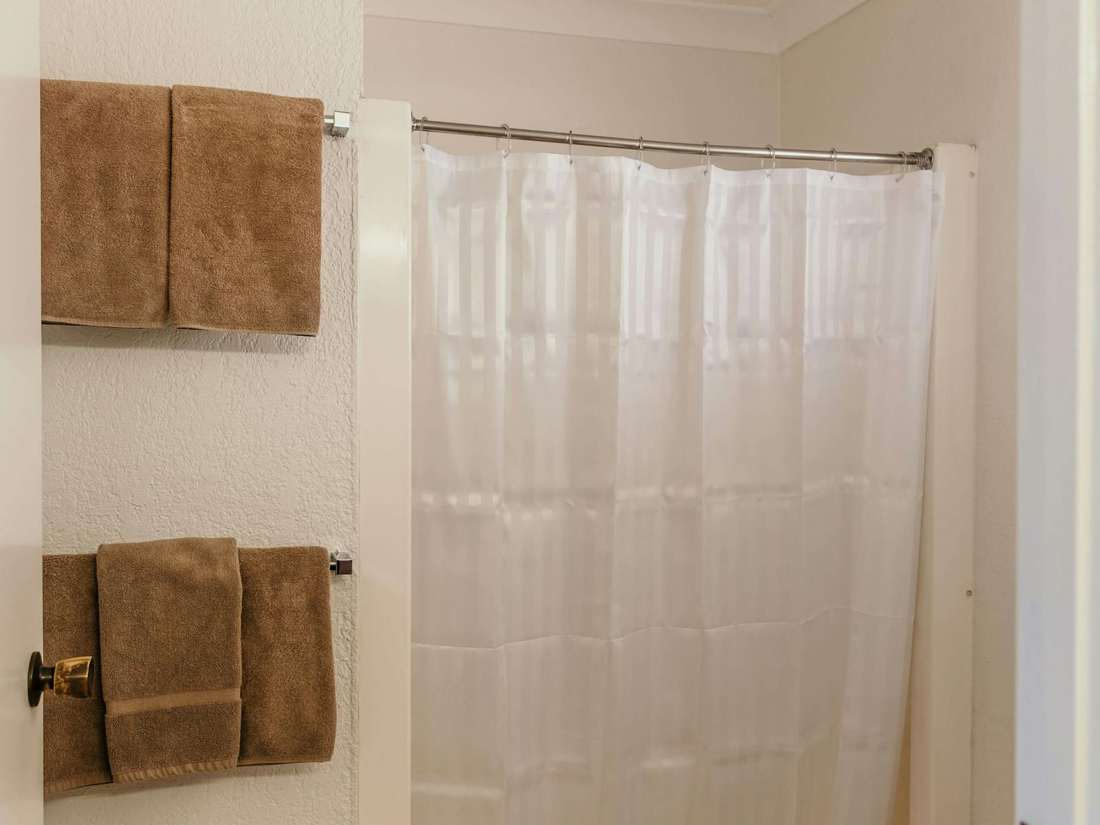 Bathroom with shower and towels