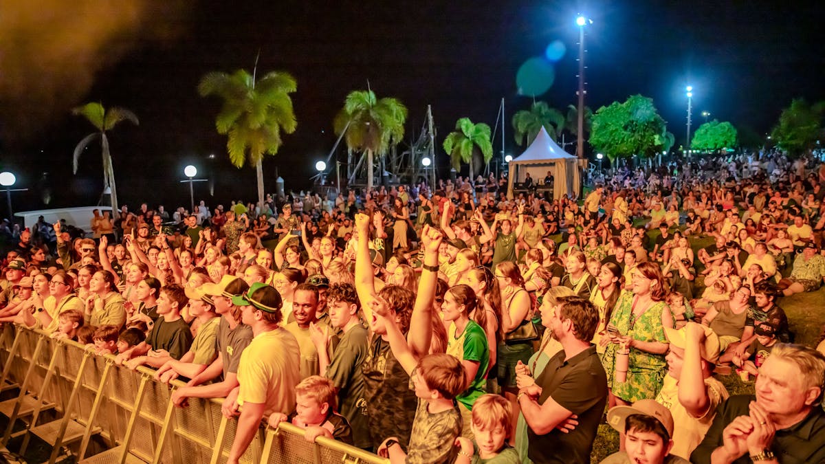 People listening to live music on the banks of the Johnstone River at Innisfail Riverfest