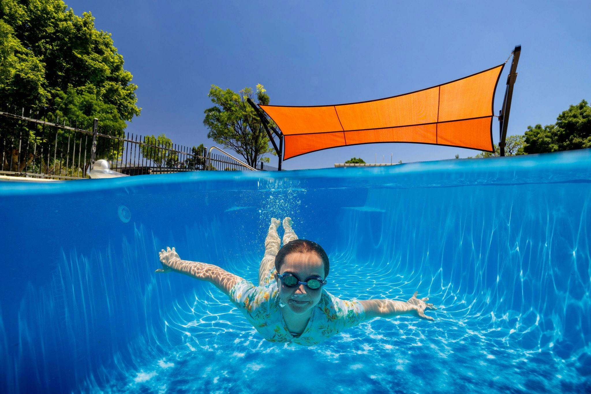 A child dives into the swimming pool