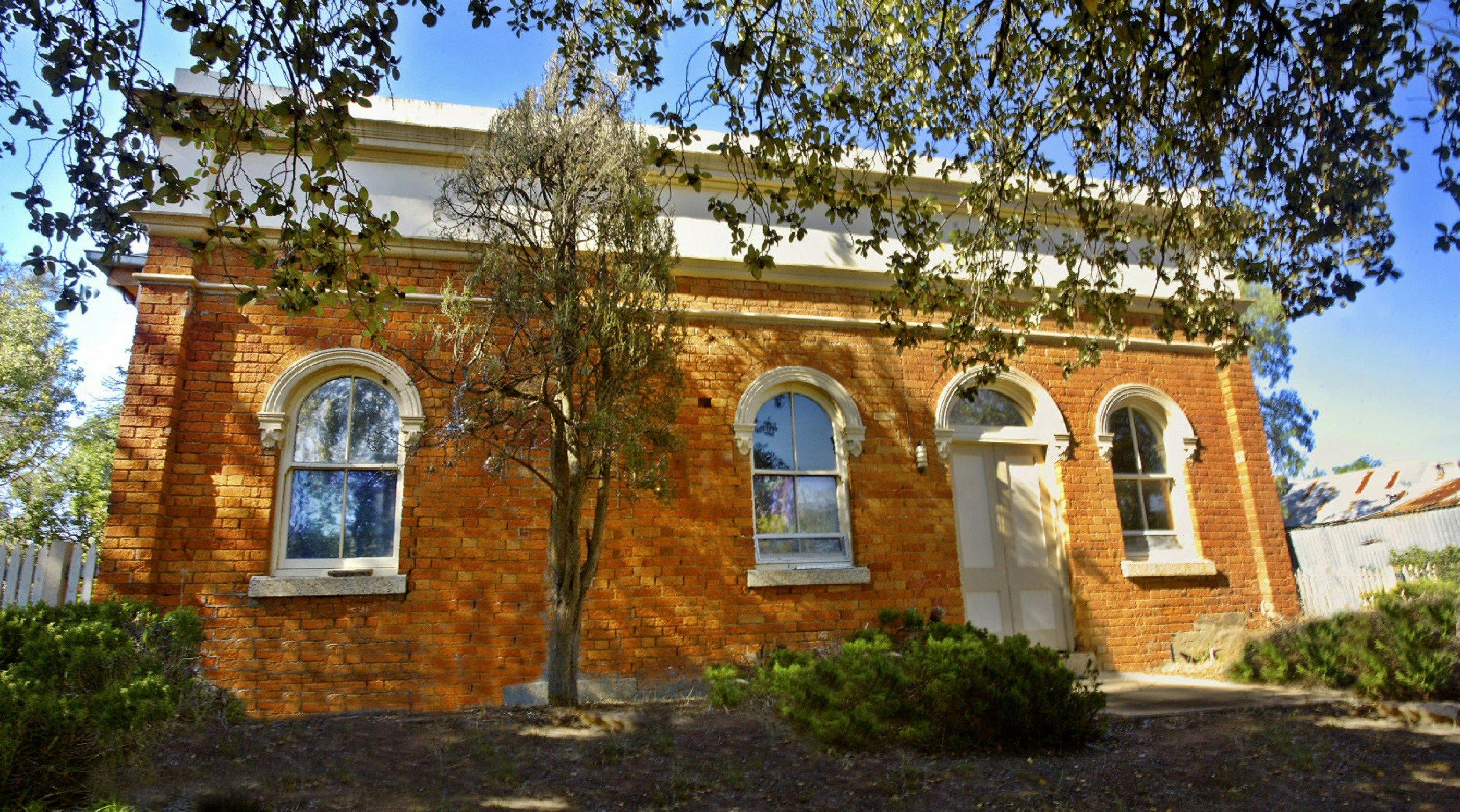 Sunny day, with historic building.