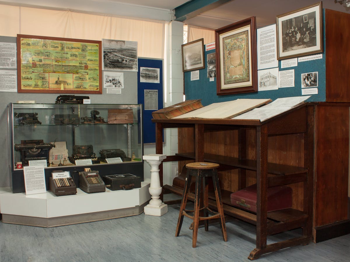 Features furniture, machines and photos of well known businesses of Townsville.