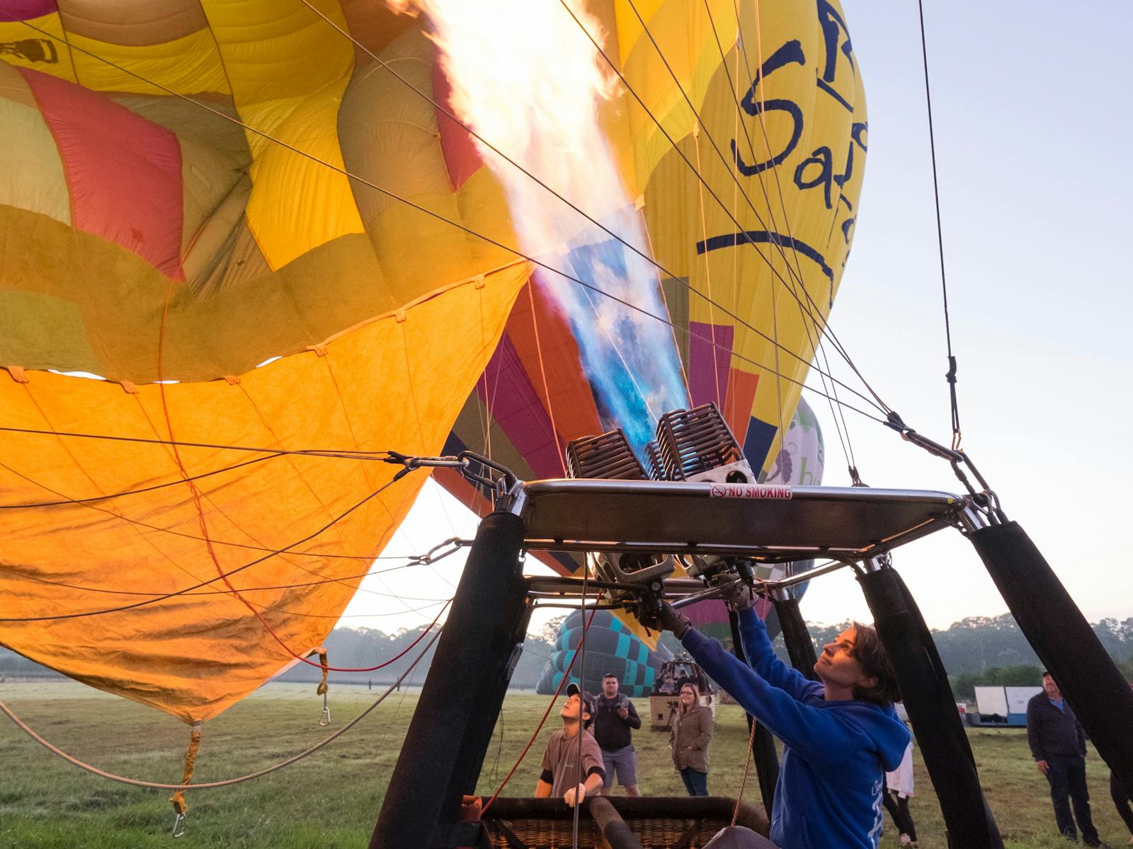 Balloon Aloft pilot uses balloon burner to heat the balloon up, ready to fly