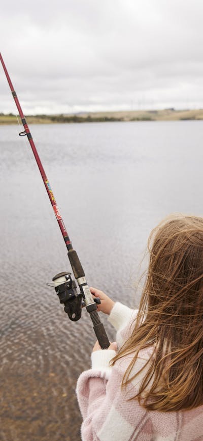 Young girl fishing at Pejar Dam