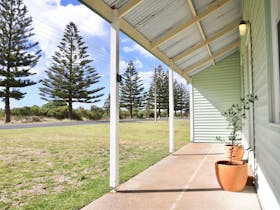The front door and veranda of Norfolk Shack face Marine Parade, with no front fence.
