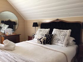 One of our upstairs en suites with a french flavour, queen size bed, and shower en suite