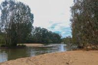 River with sandy and forested banks.