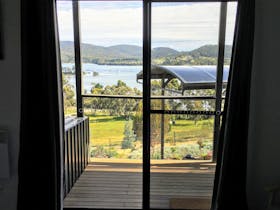 A spectacular view from the bed in the Protea Room to Parson's Bay to enjoy in comfort.