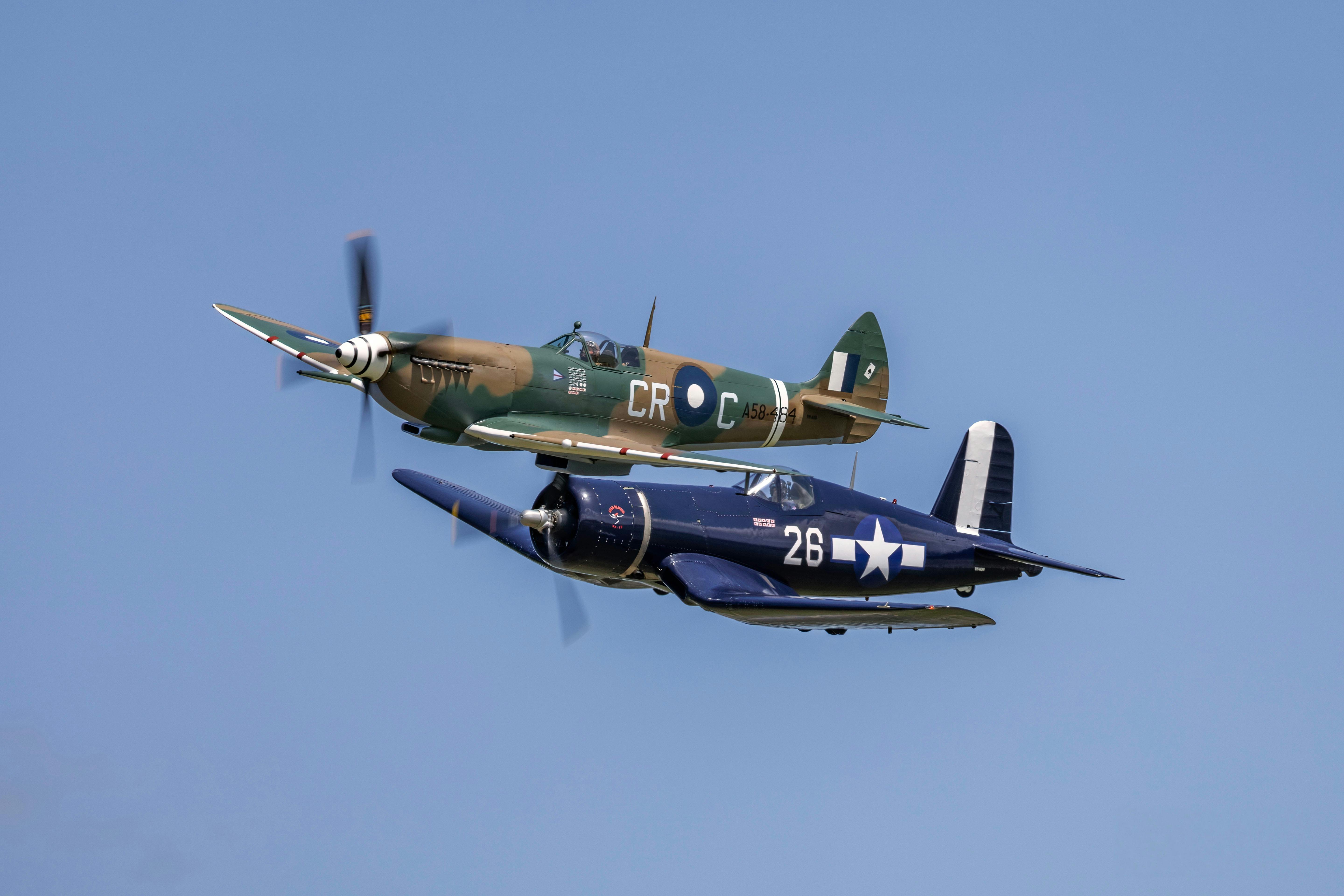 A Supermarine Spitfire and F4U-1D Corsair fly in formation at Barrington Coast Airshow