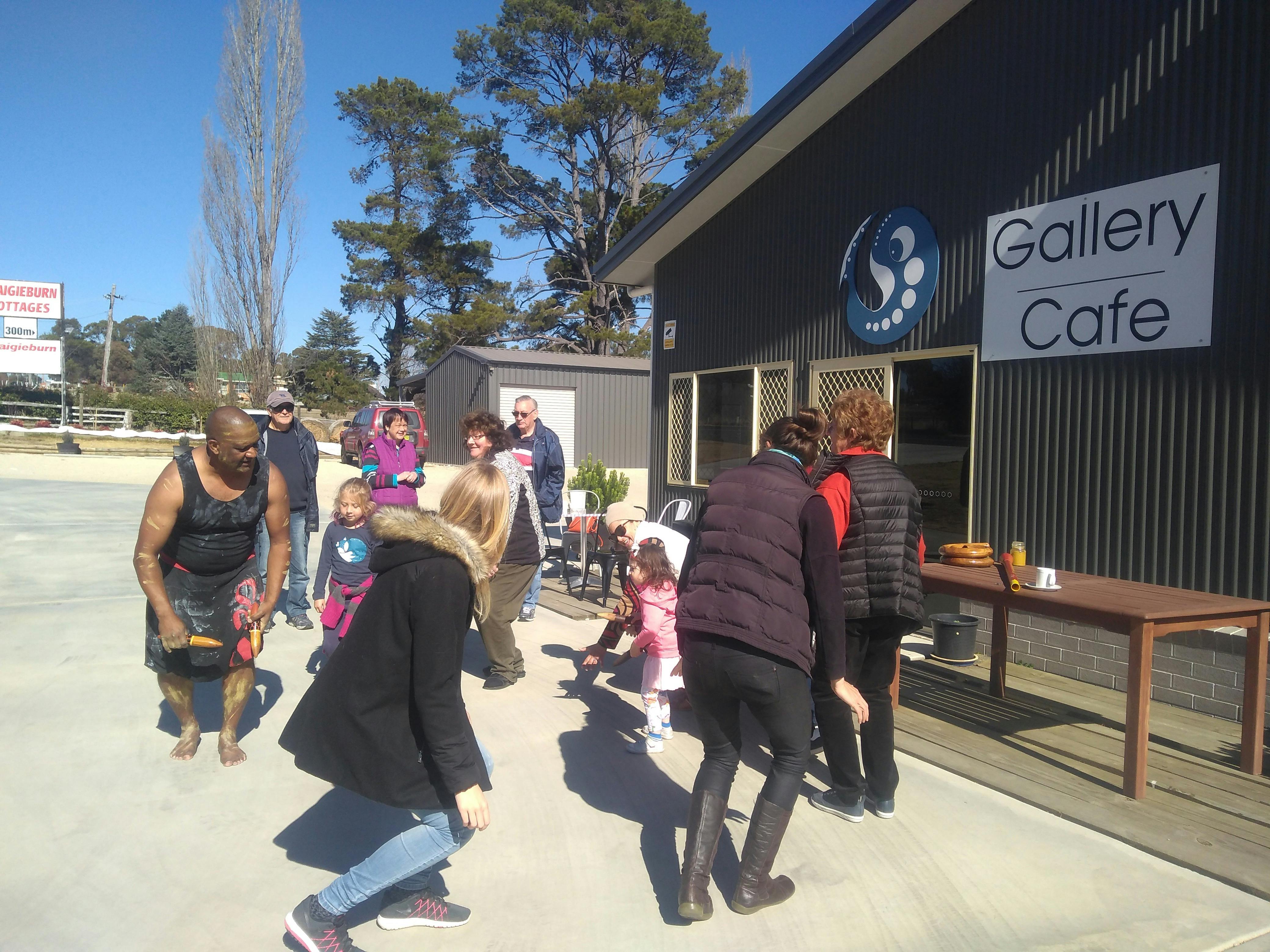 Group of tourists learing how to shake a leg  with Bob Blair