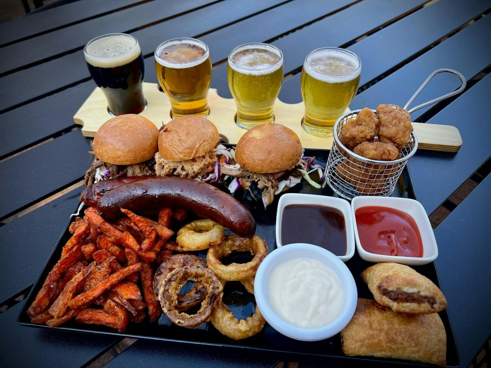 Smoked meats, burger sliders, beer paddles