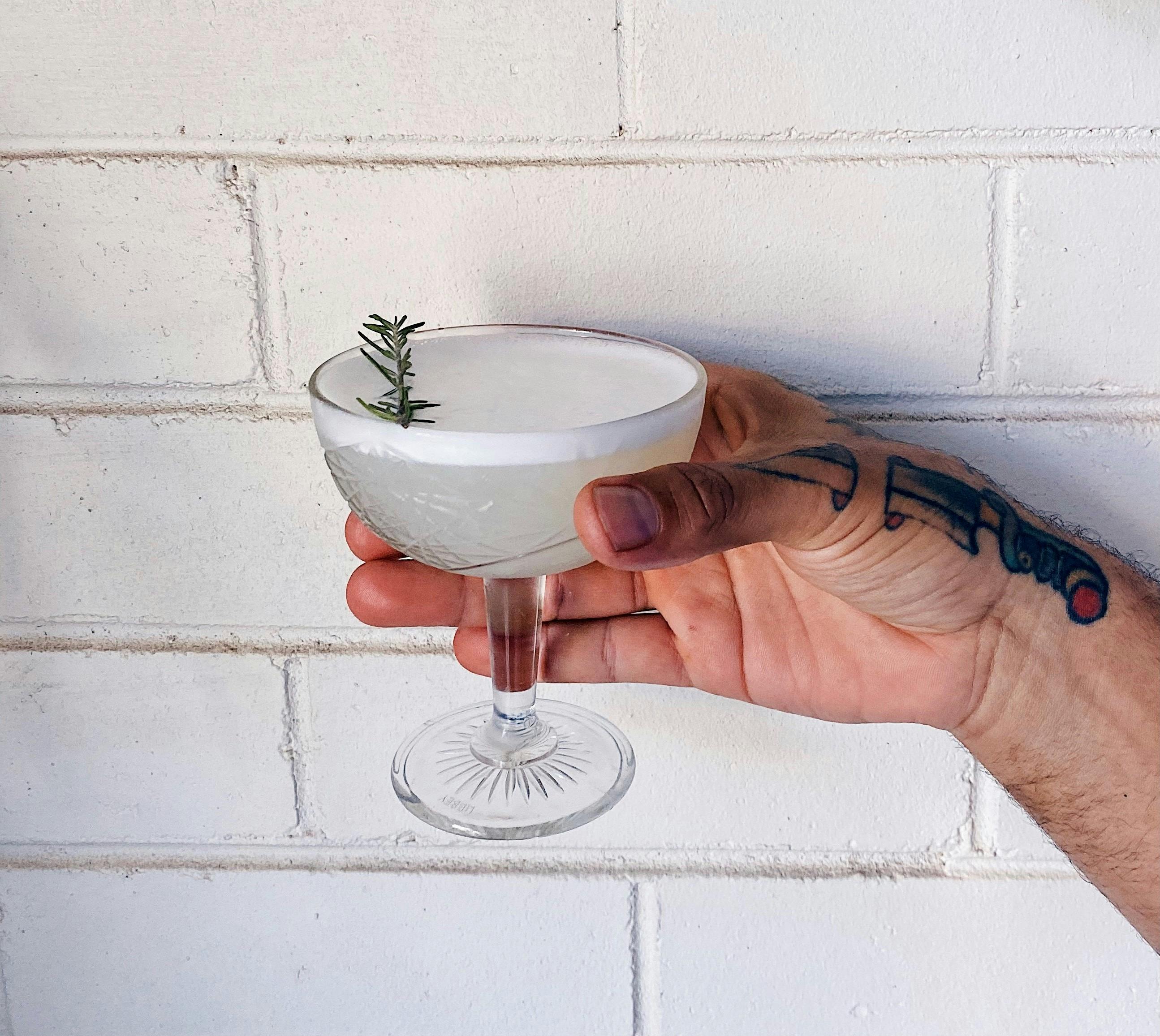 Cocktail against white wall