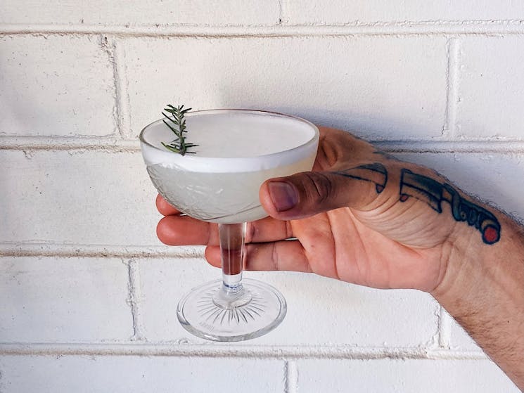Cocktail against white wall