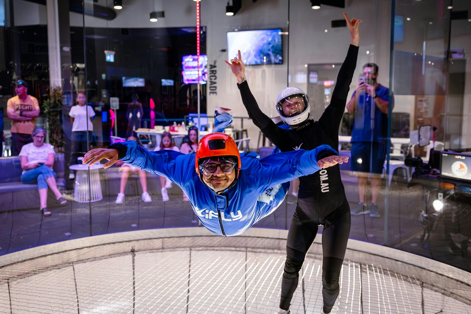 Instructor cheers as happy flyer flies solo.