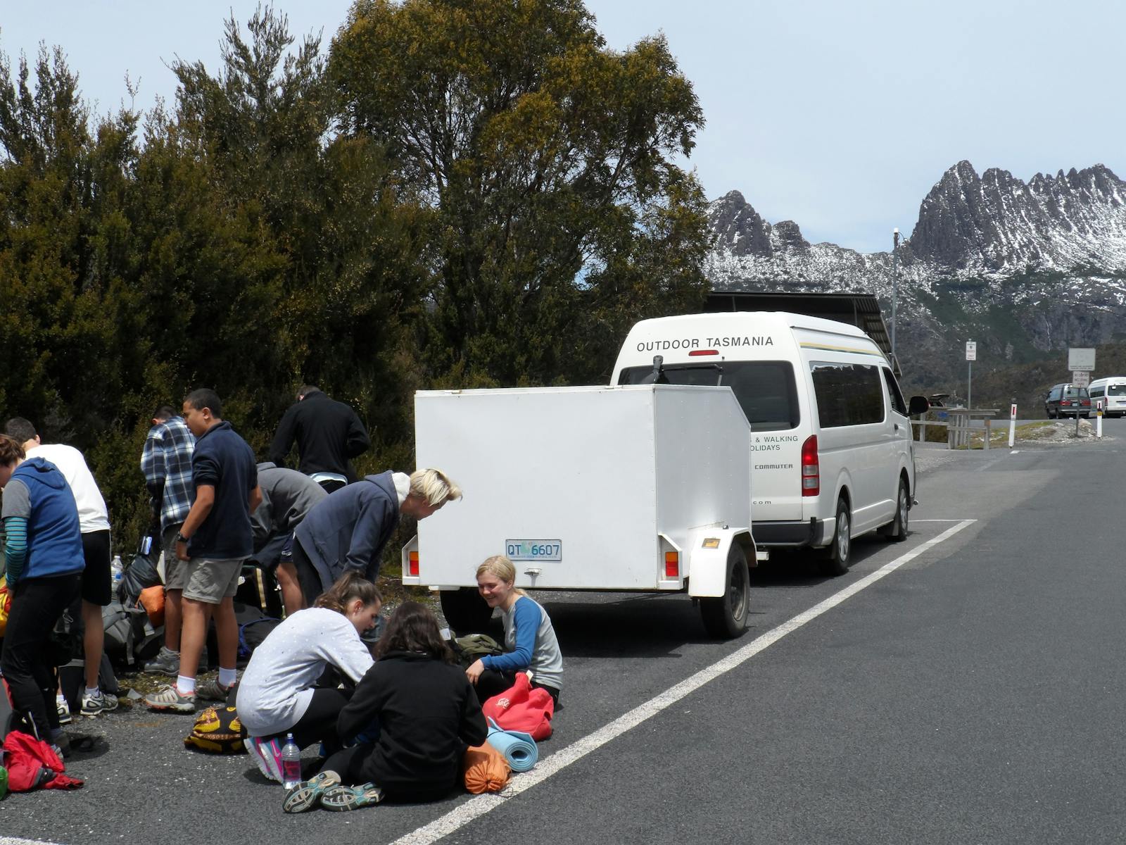 A school group prepairing to set out on the Overland Track Walk, our bus in background
