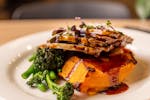 Plate with roast lamb, gravy, vegatables