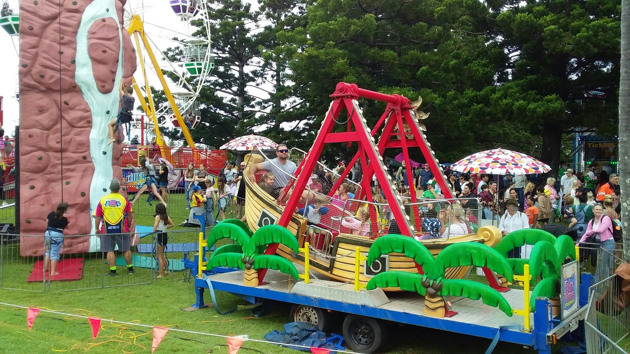 People enjoying carnival rides