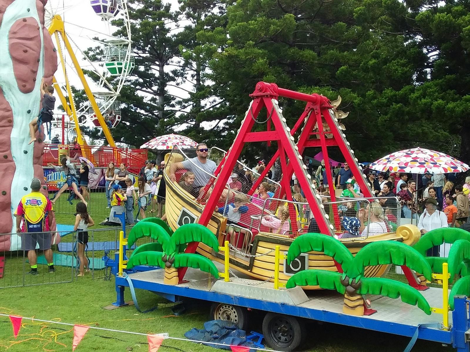People enjoying carnival rides