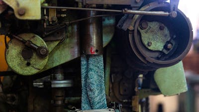 One of the vintage machines in action at the Lindner Socks Factory.