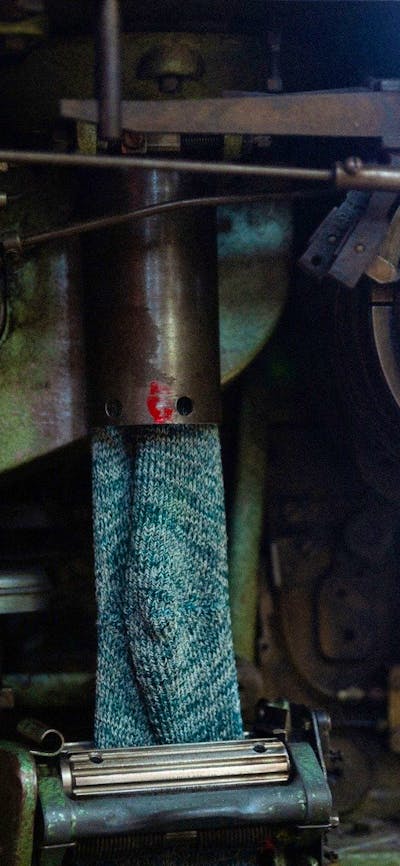 One of the vintage machines in action at the Lindner Socks Factory.