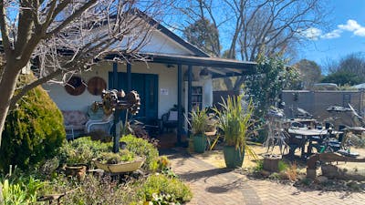 Exterior of the building. Beautiful gardens and eating and seating areas shared with local cafe.