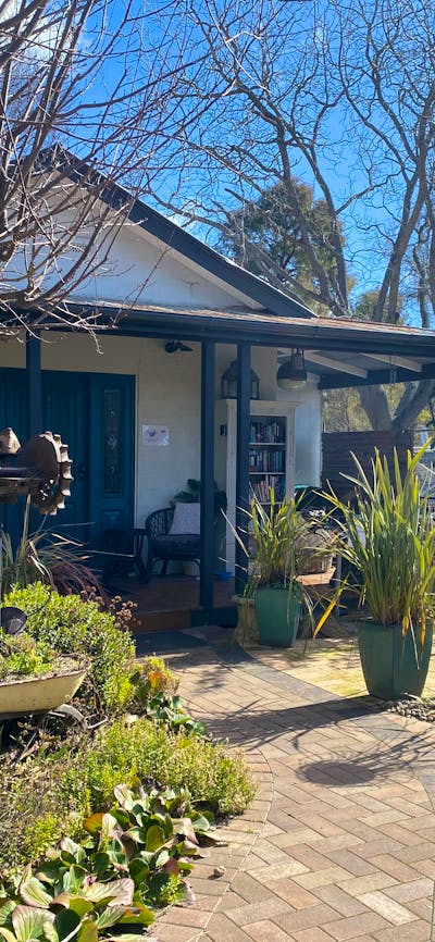 Exterior of the building. Beautiful gardens and eating and seating areas shared with local cafe.