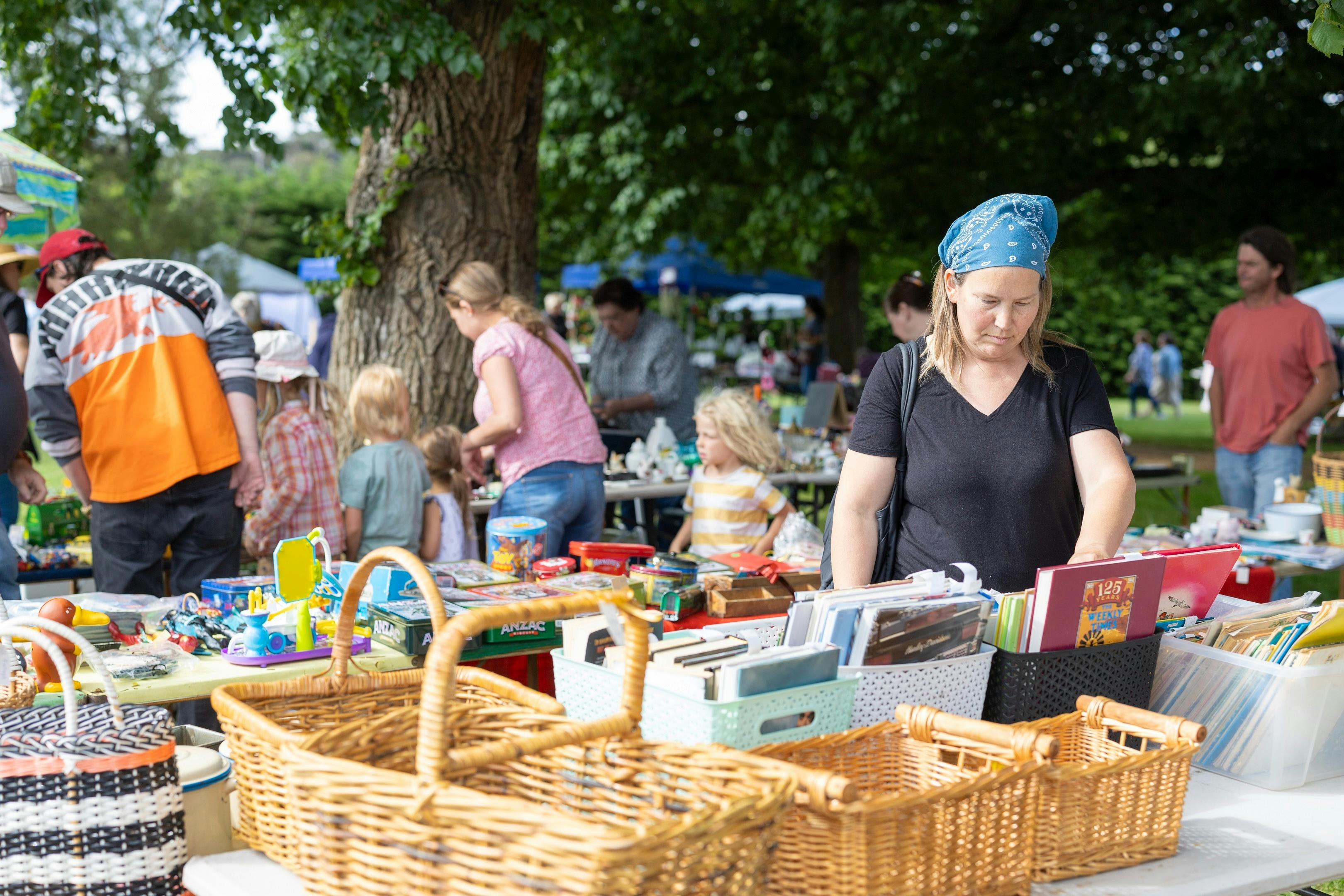People browsing a market stall