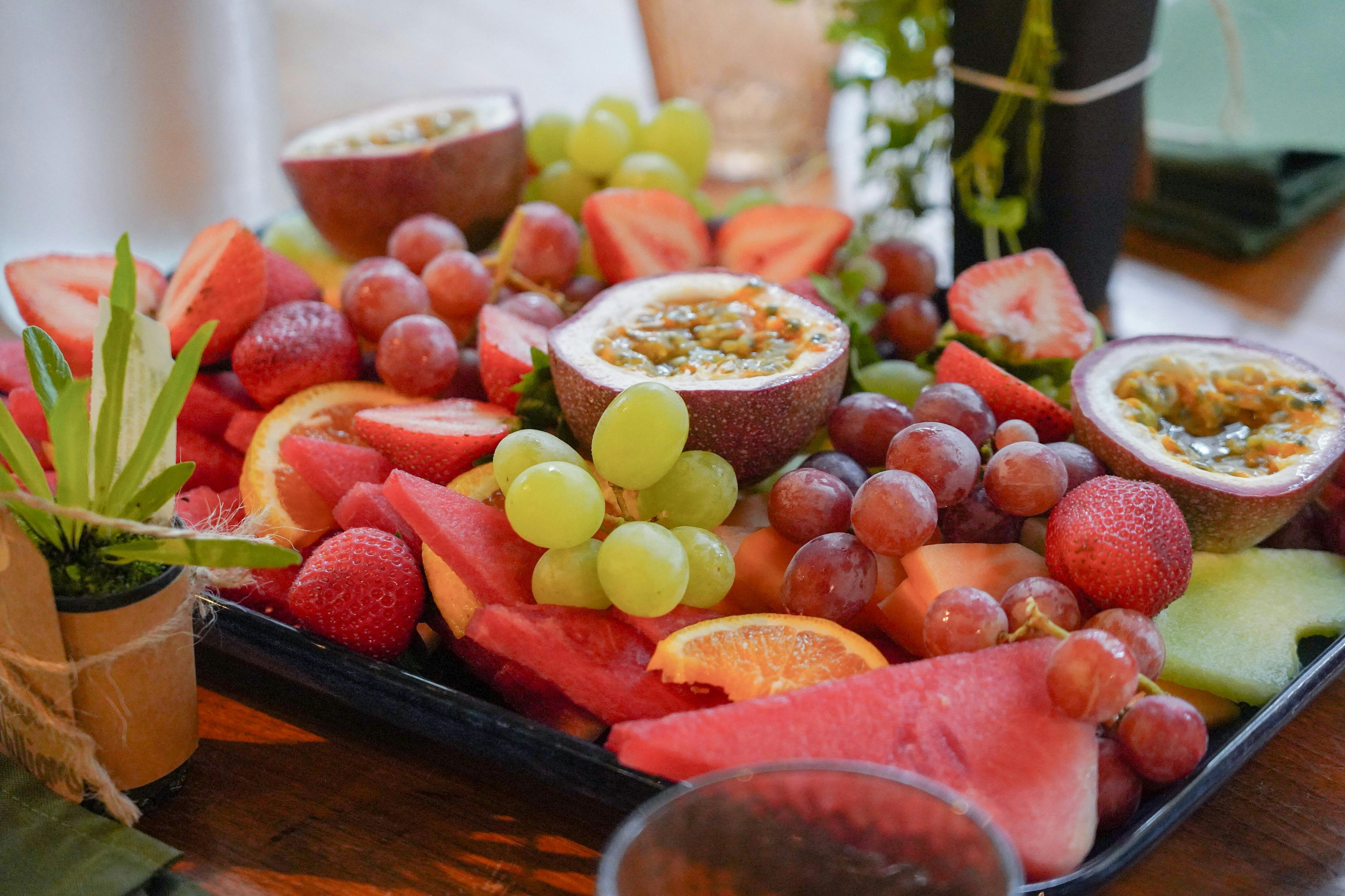 Fruit platter of watermelon, grapes, passionfruit, strawberries