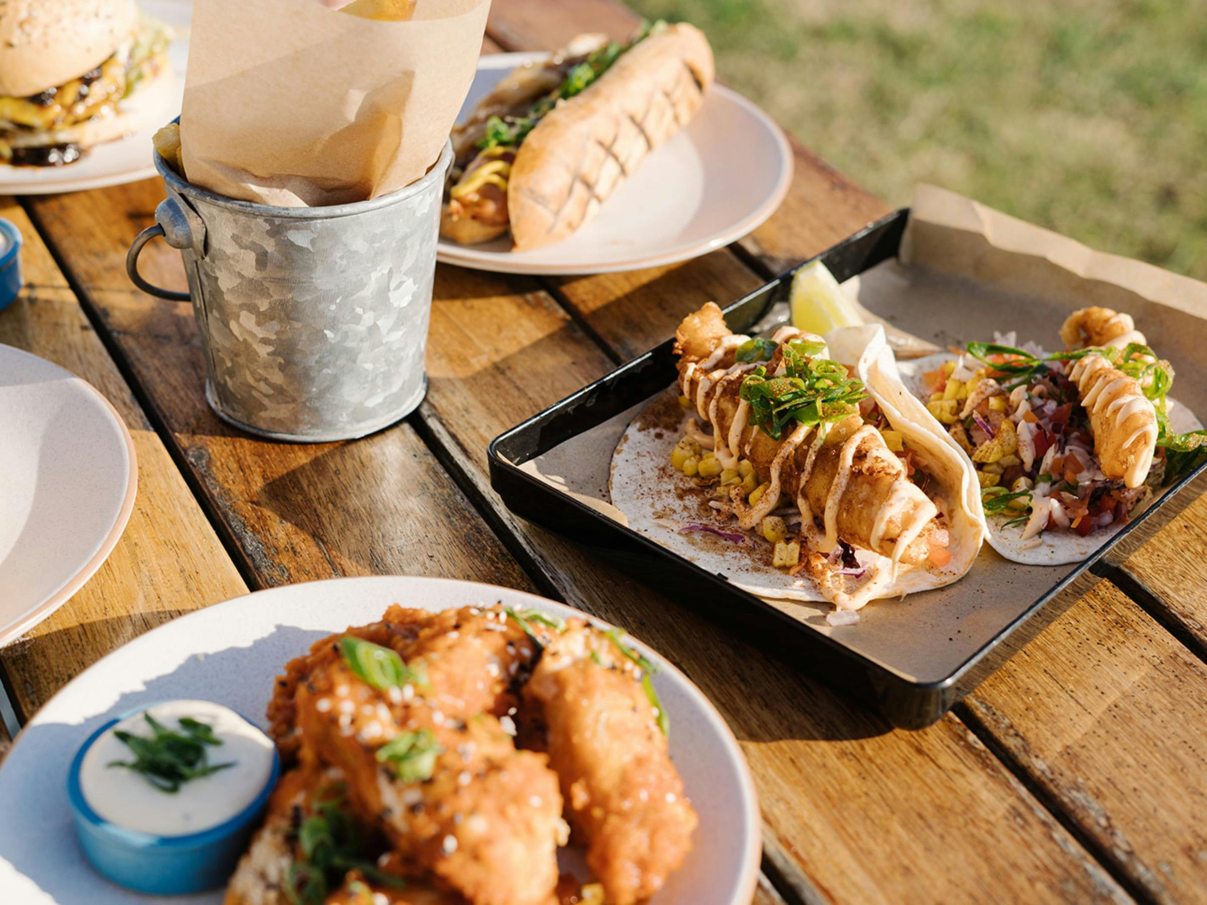 Tacos from the specials menu with bucket of fries.