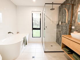 Bathroom with bath in Blue Wren villa