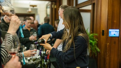 lady pouring wine