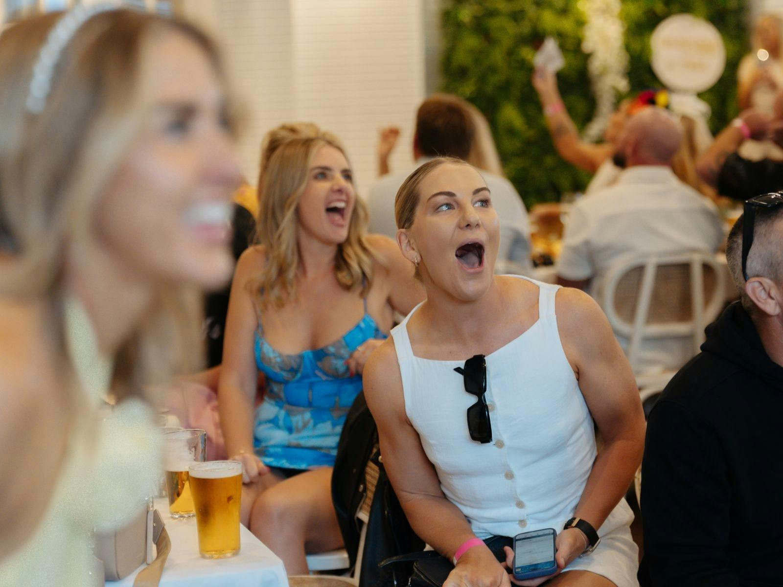 Guests reacting to the Melbourne Cup race at Towradgi Beach Hotel.