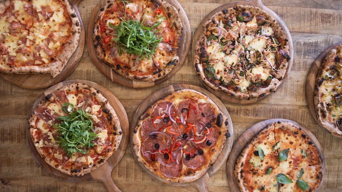 An arial photo of a selection of wood fired pizza