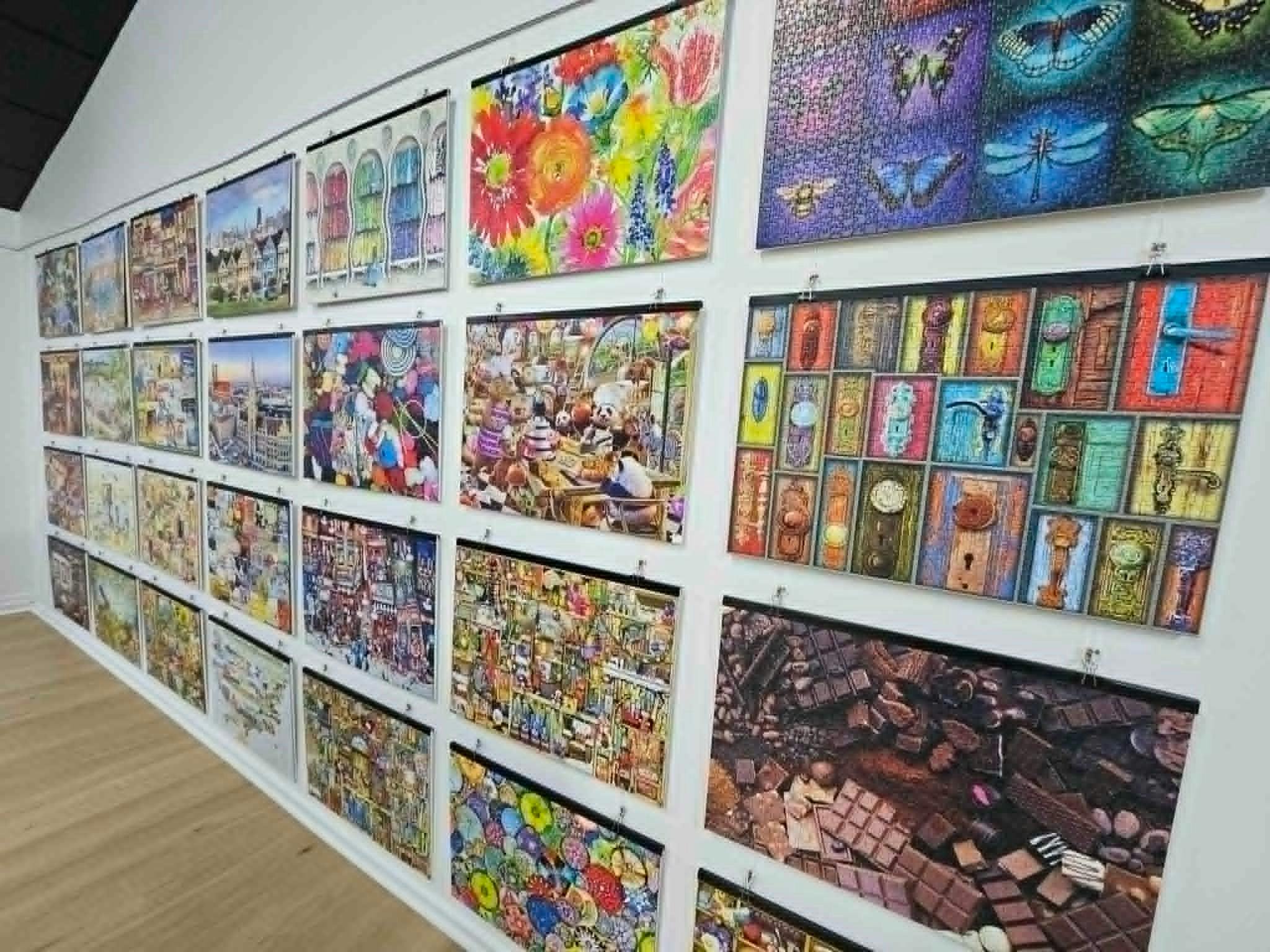 Wall of colourful 1000 piece puzzles completed and donated by a Bridgetown local