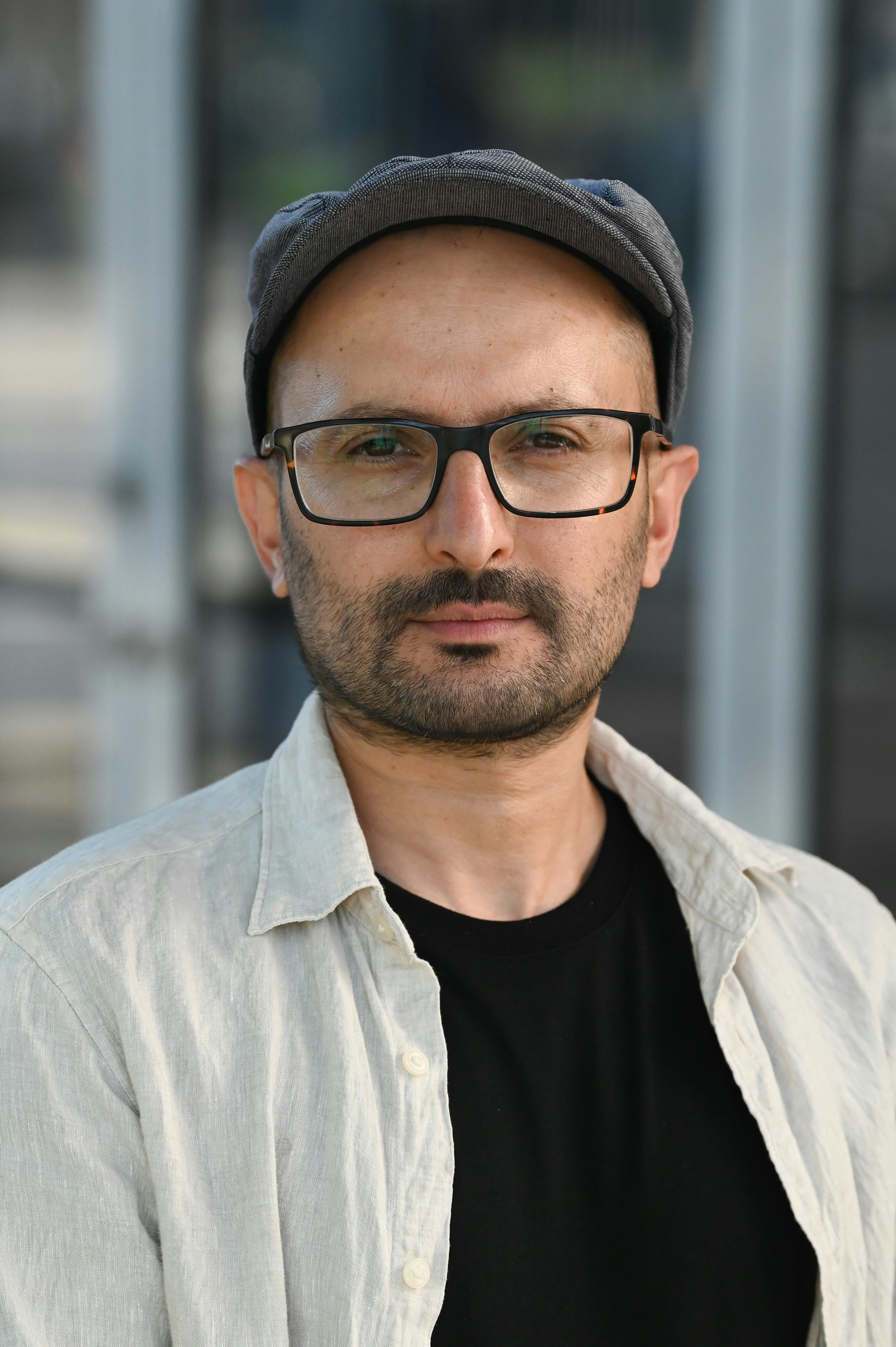 A man in a hat and glasses