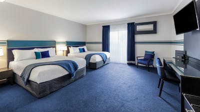 Two Queen beds, sleeps four.