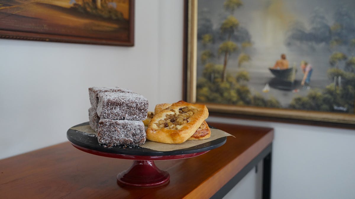 Lamingtons and pastries on a plate
