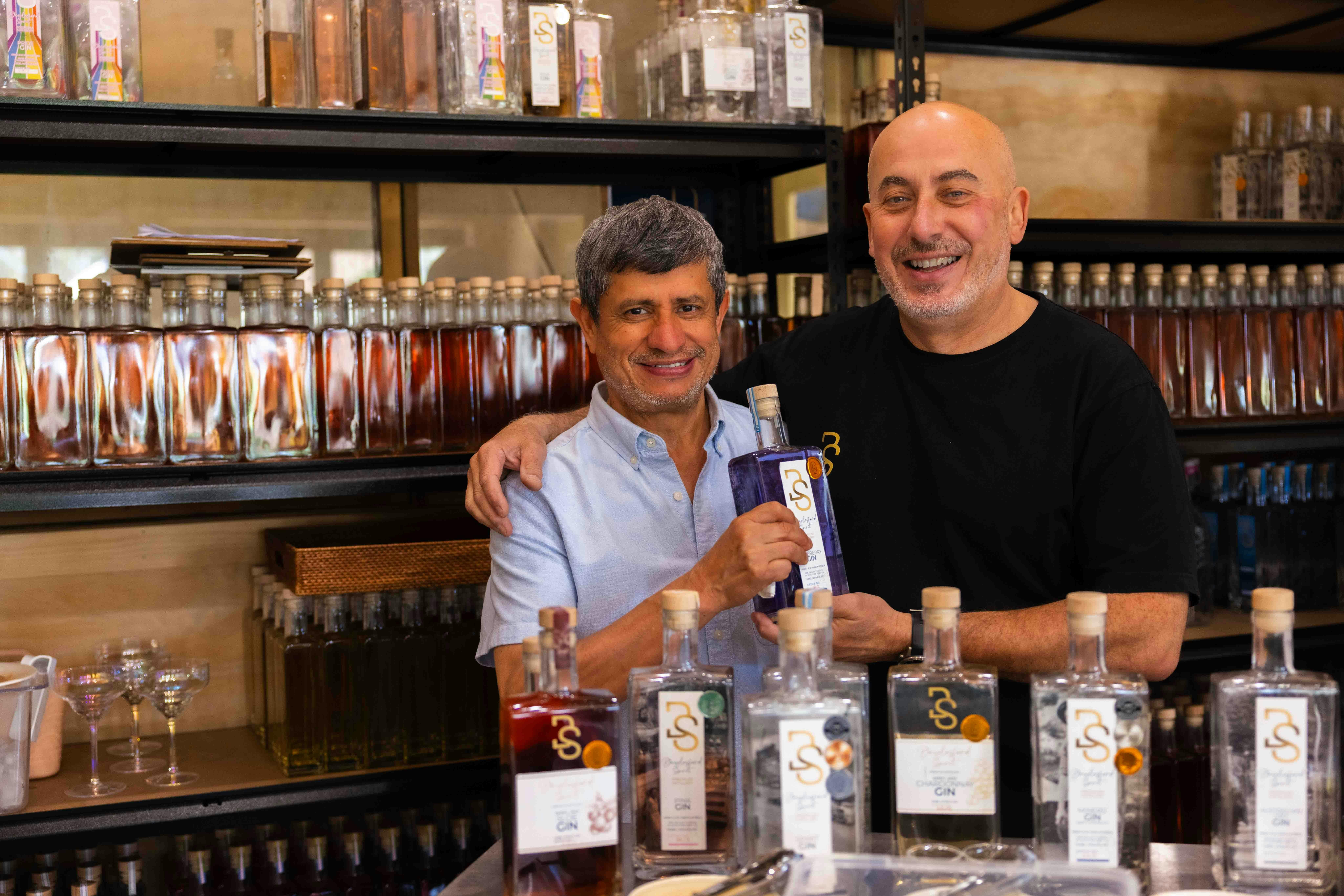 Raul with the "Maker" Michael.  A range of bottles of gin around them