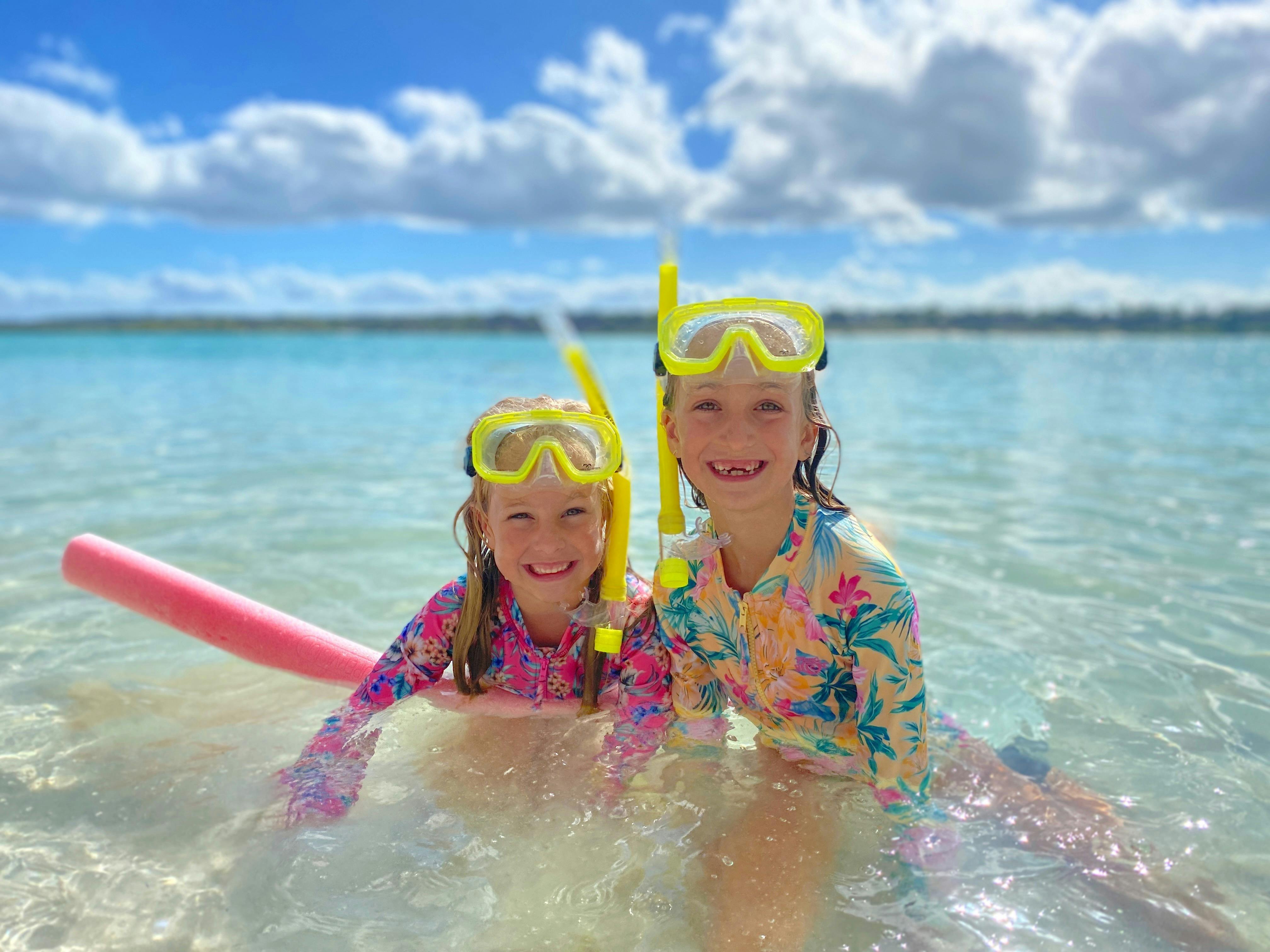 Two girls snorkelling Wathumba Creek, K'gari