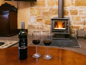 Mintaro Hideaway - Jollys Rest enjoy a red wine in front of the log fire on a comfy chesterfield