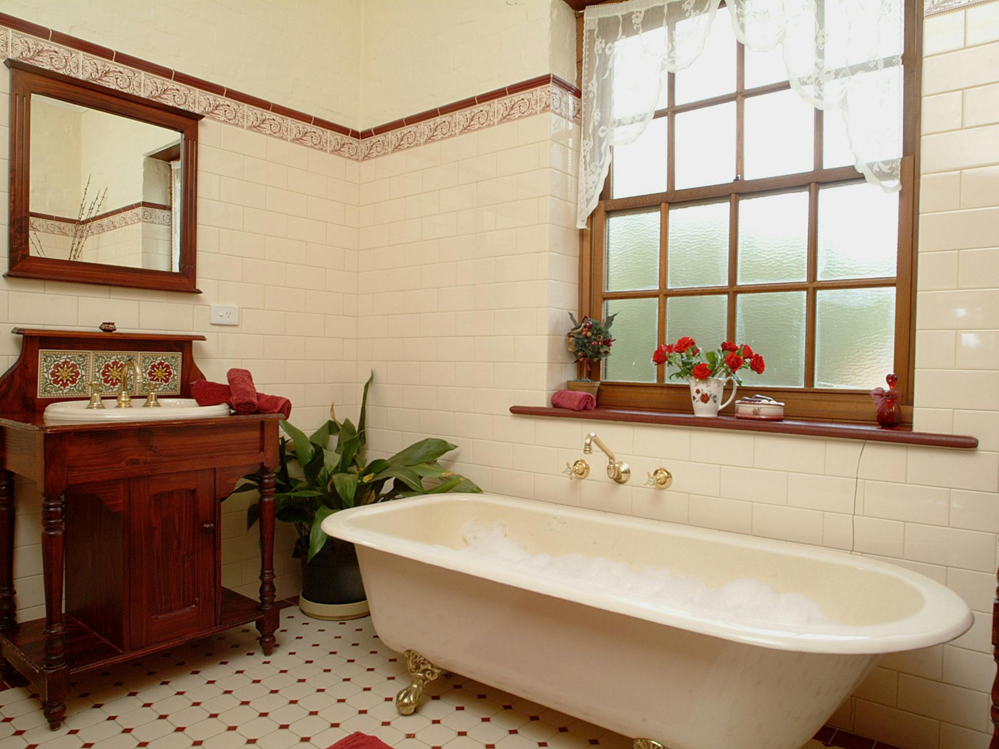 Soak in the large claw footed bath or enjoy the separate  rain water shower.