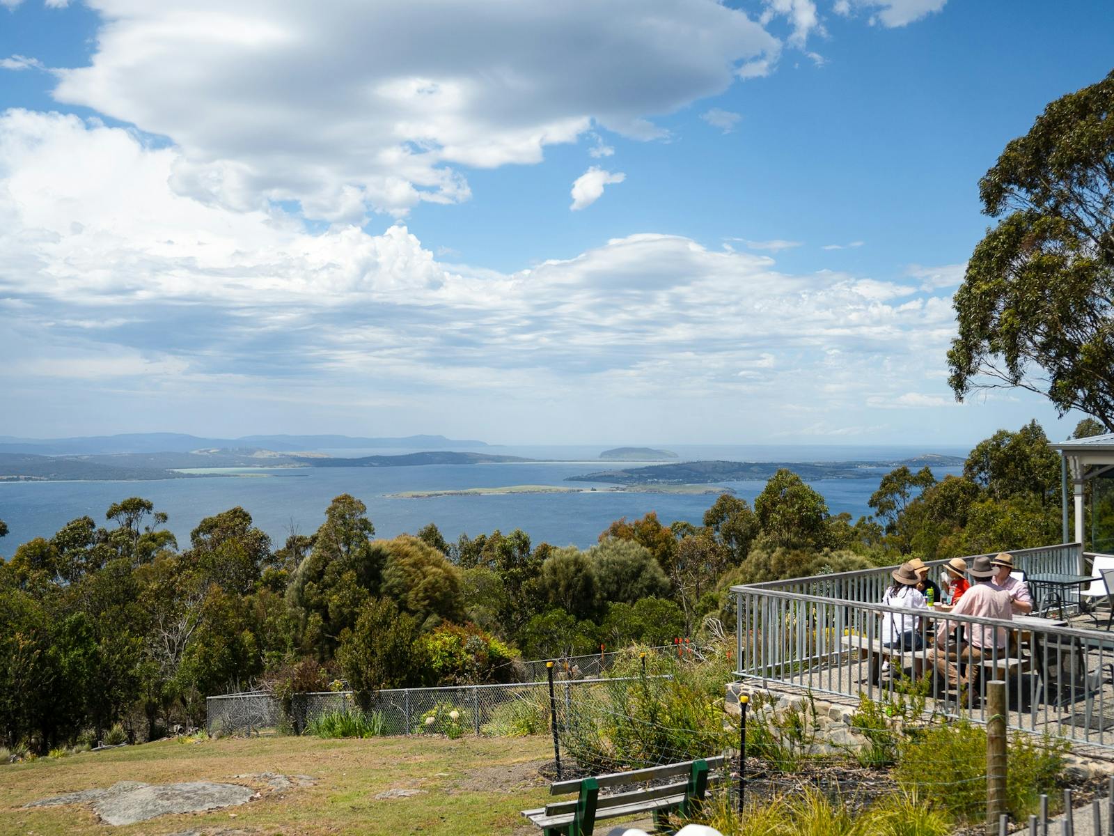 View of Derwent River from Mt. Nelson with people having lunch in foreground.