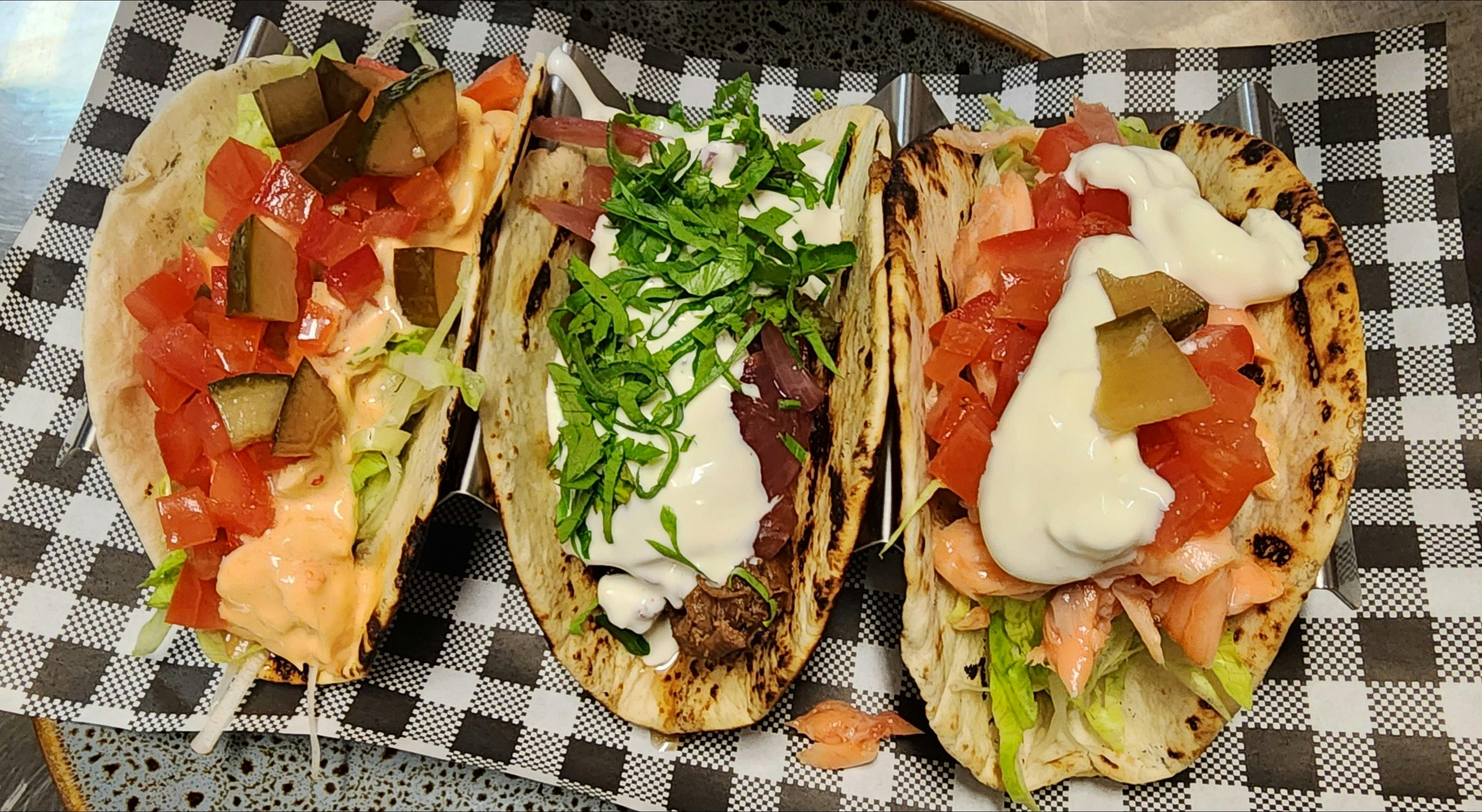 Trout, pulled beef & chicken tacos
