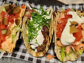 Trout, pulled beef & chicken tacos