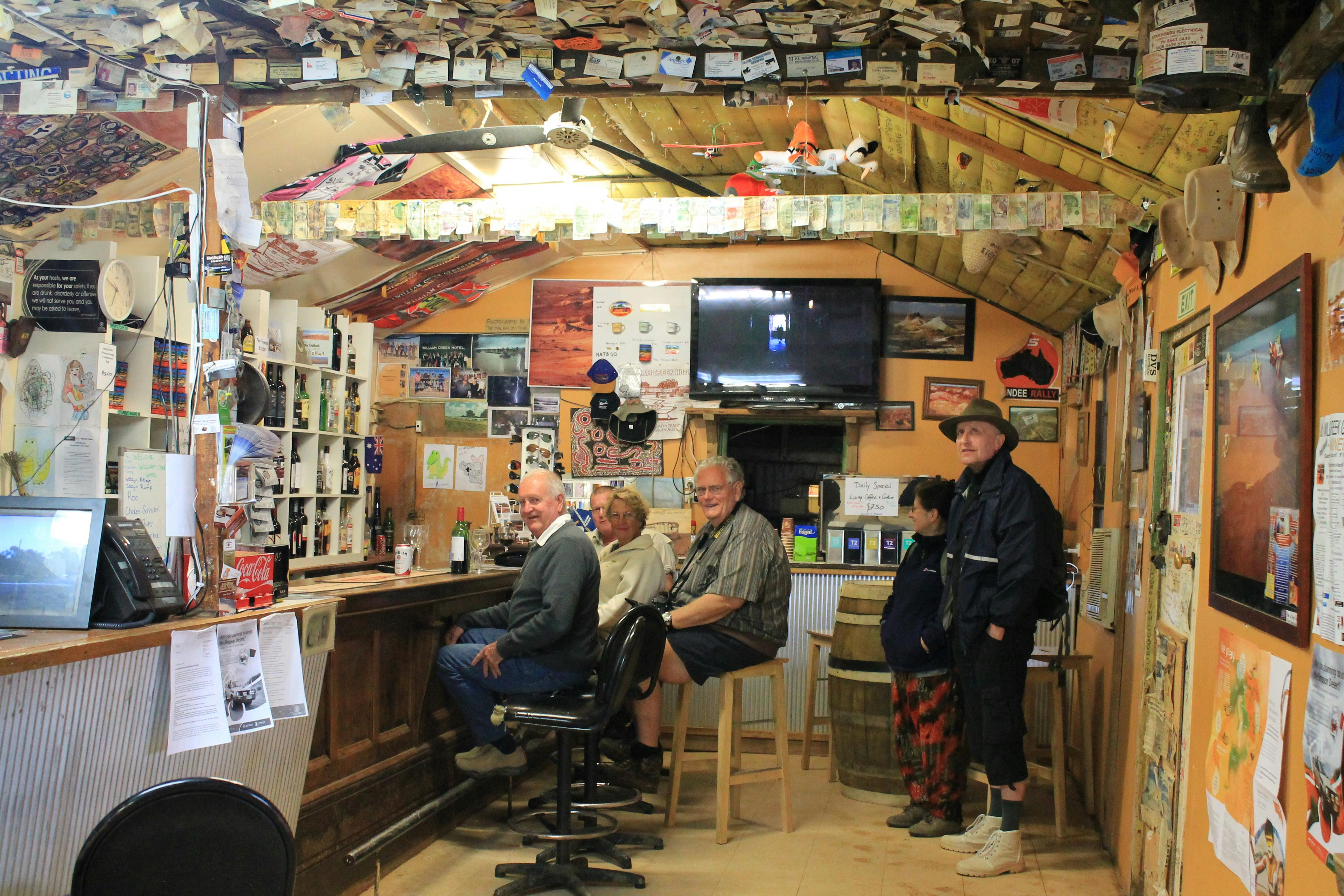 People sitting inside William Creek Pub