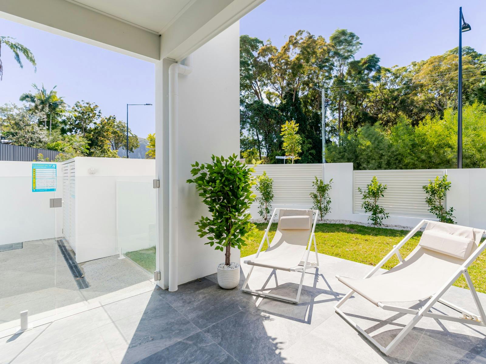 Balcony with outdoor dining, BBQ and sun-loungers