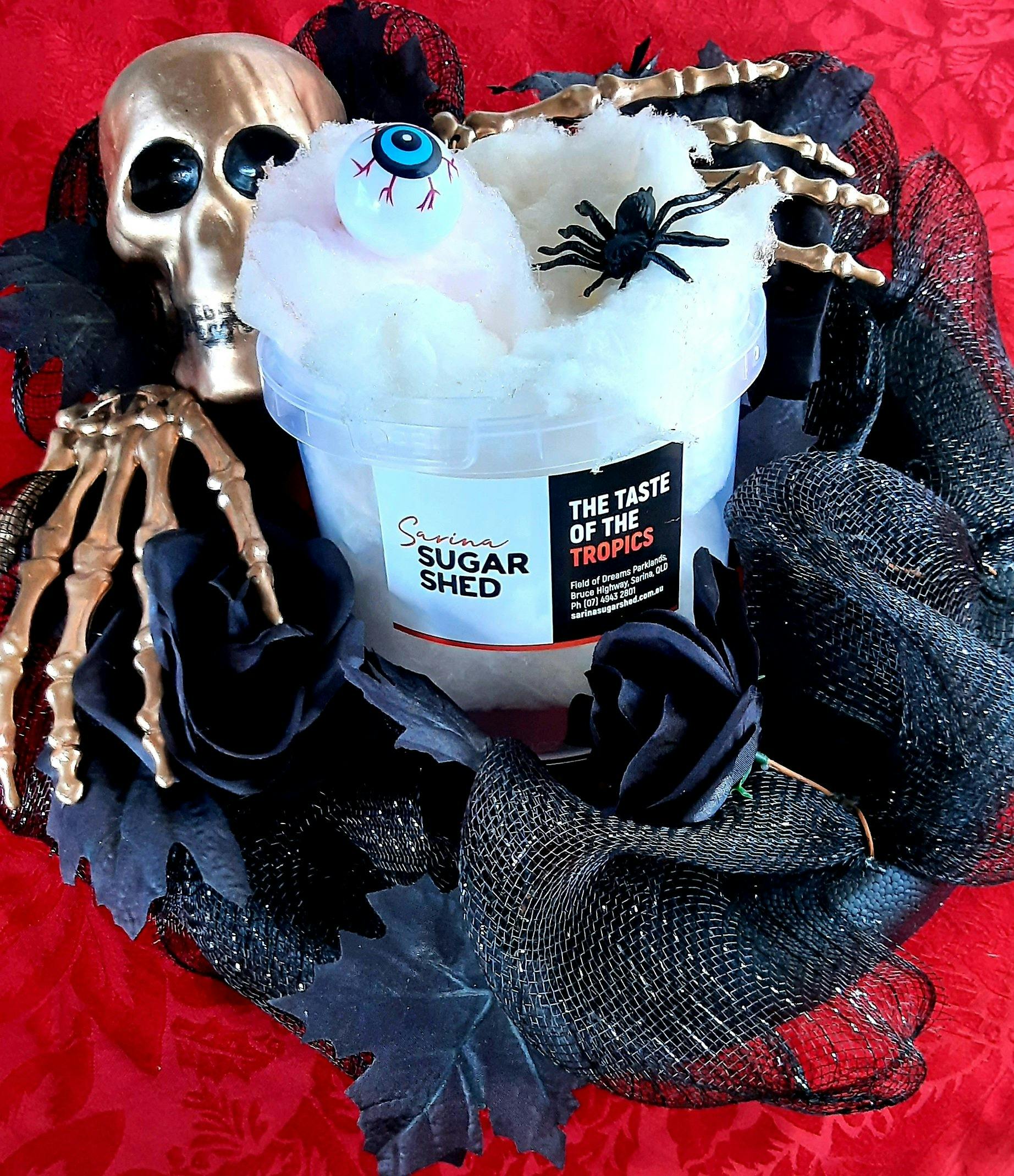 Fairy floss bucket with skeleton and black decorations surrounding