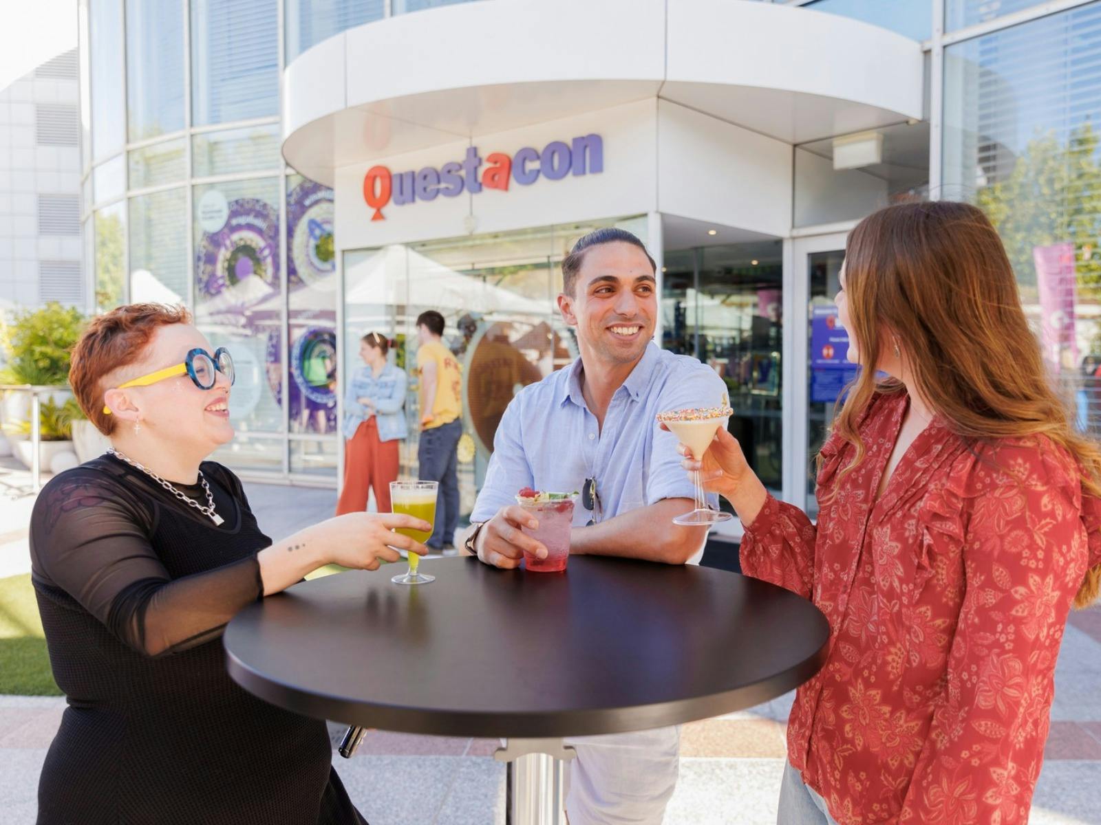 A group of friends enjoying a drink outside Questacon