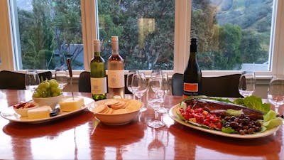 wine cheese crackers smoked trout anitpasto on table